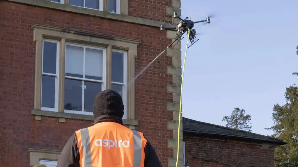 Ben cleaning a building with an AC4 drone